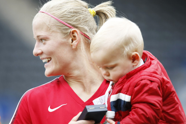 Football - Everton Ladies v Arsenal Ladies - FA Women's Premier League - The Stobart Stadium - Widnes - 08/09 , 10/5/09 Katie Chapman - Arsenal Ladies celebrates victory with her son Mandatory Credit: Action Images / Keith Williams