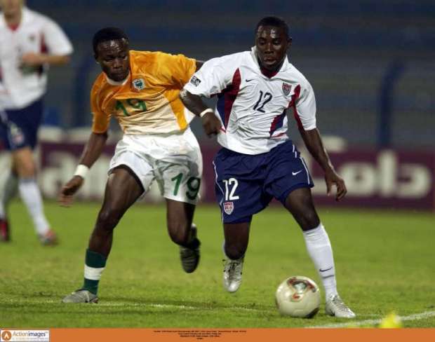 Football - FIFA World Youth Championship UAE 2003 - USA v Ivory Coast - Second Round - Dubaii - 8/12/03 Ivory Coast's Kassiaty Labi and USA's Freddy Adu Mandatory Credit: Action Images / John Sibley Livepic